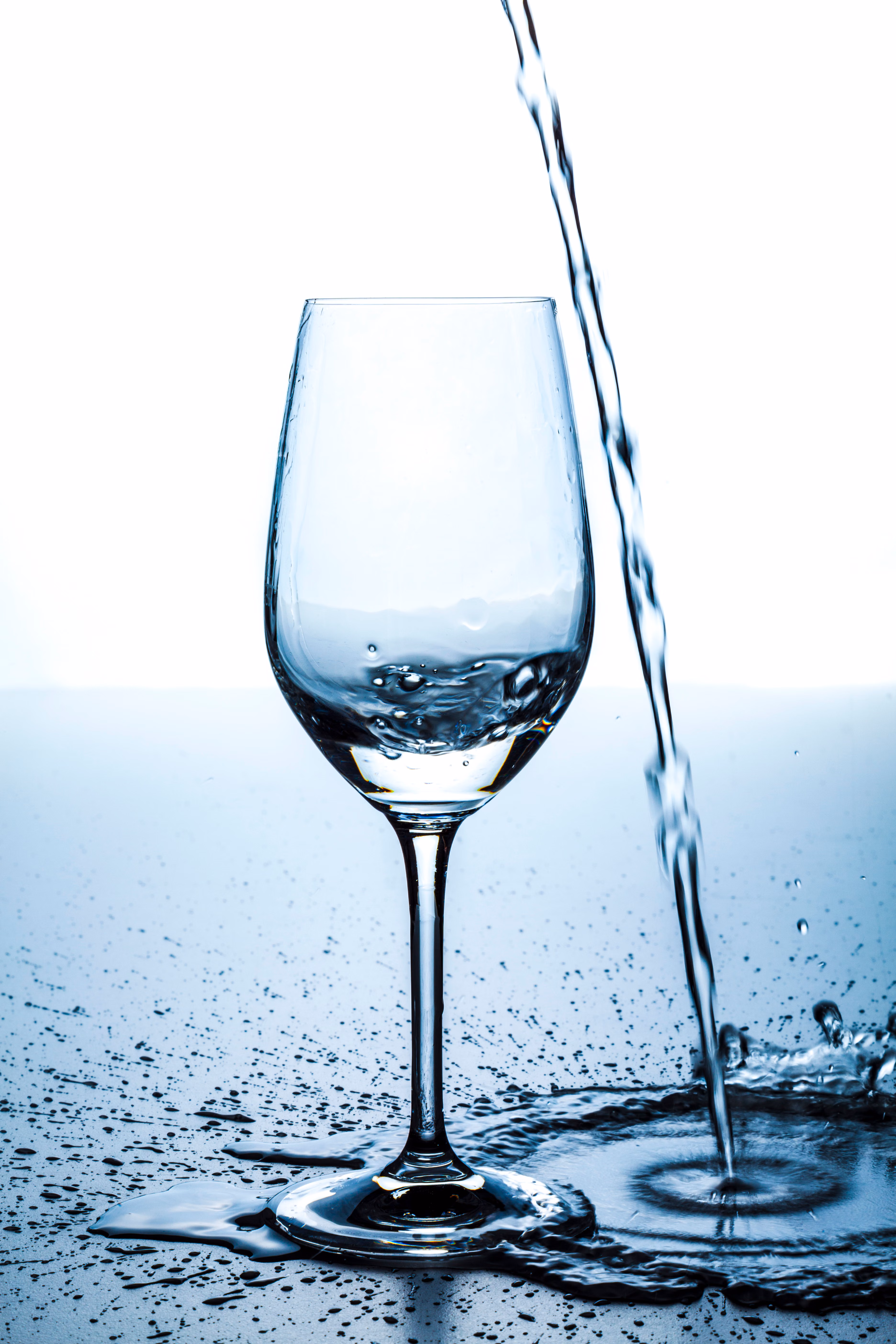 poor water into glass