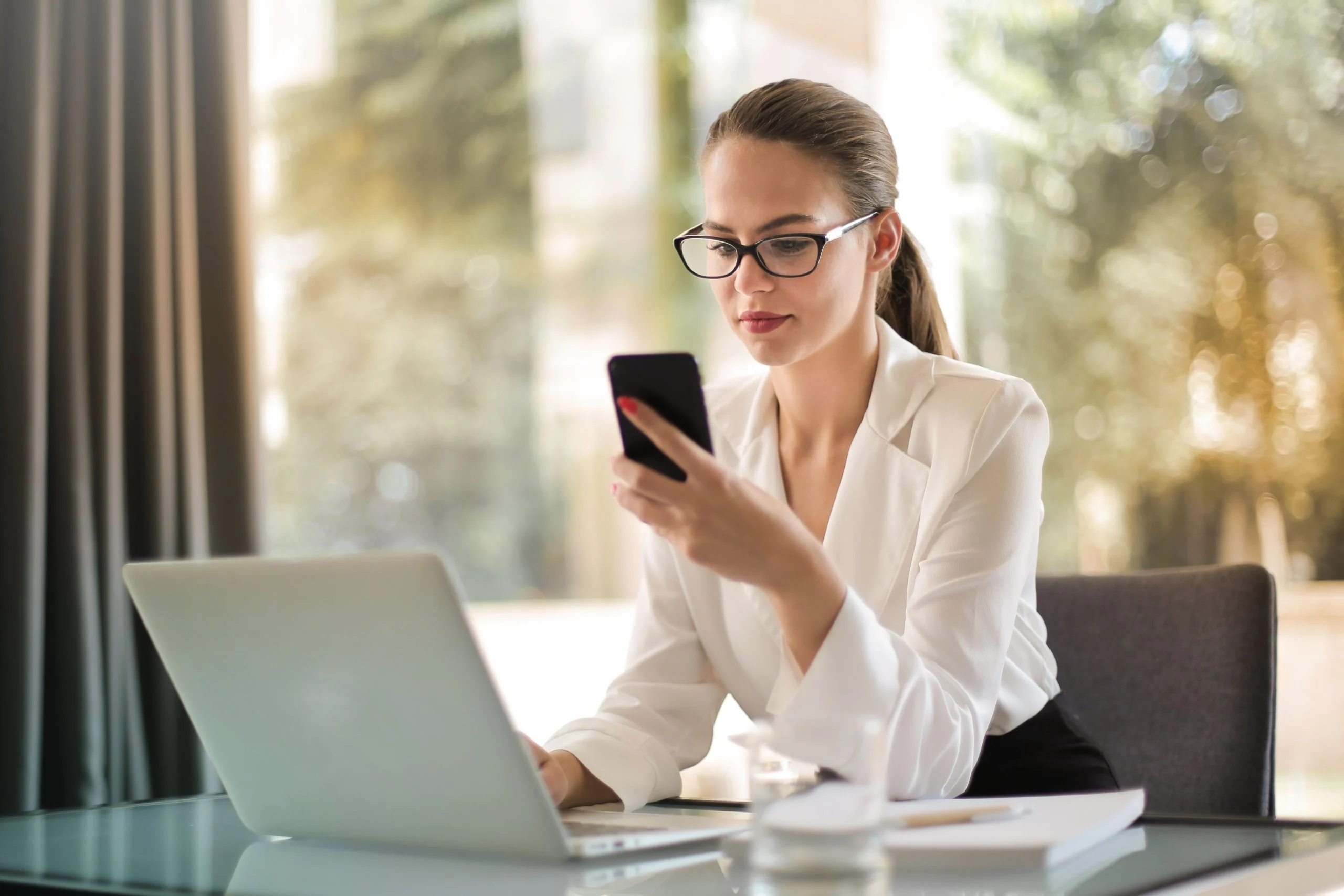 a woman looking at a phone